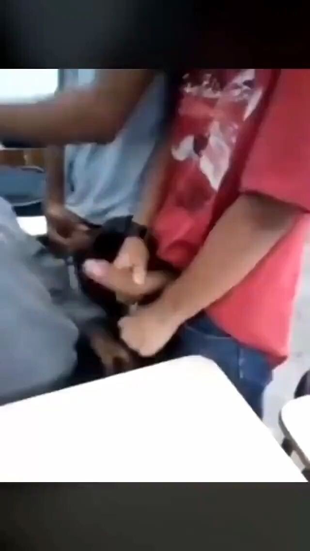 Two guys take turns to get blow jobs in class
